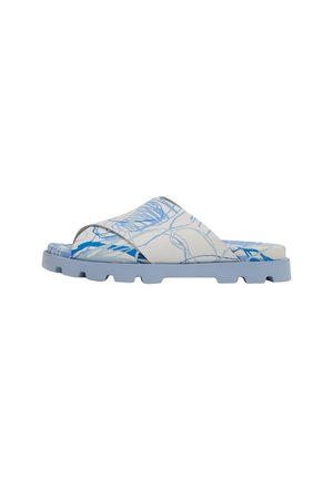 Sandale à semelle et empeigne bleu clair avec des motifs abstraits bleu et blanc gribouillés, vue de côté.