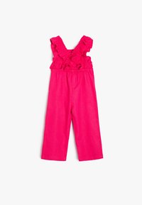 Lys rosa jumpsuit med volangaxlar, elastisk midja och vida ben. Mjuk textur och avslappnad design.