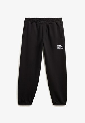 Zwarte trainingsbroek met een elastische tailleband, twee zijzakken en een witte logopatch op het linkerpand. Glad, rekbaar materiaal.