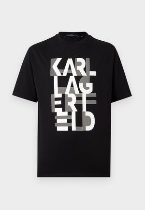 Black short-sleeve t-shirt with large white stylized text "KARL LAGERFELD" stacked vertically on the front.