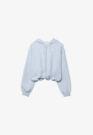 Light gray cropped hoodie made of soft fabric. Features a zip front, drawstring hood, and elasticized hem and cuffs. Smooth texture.