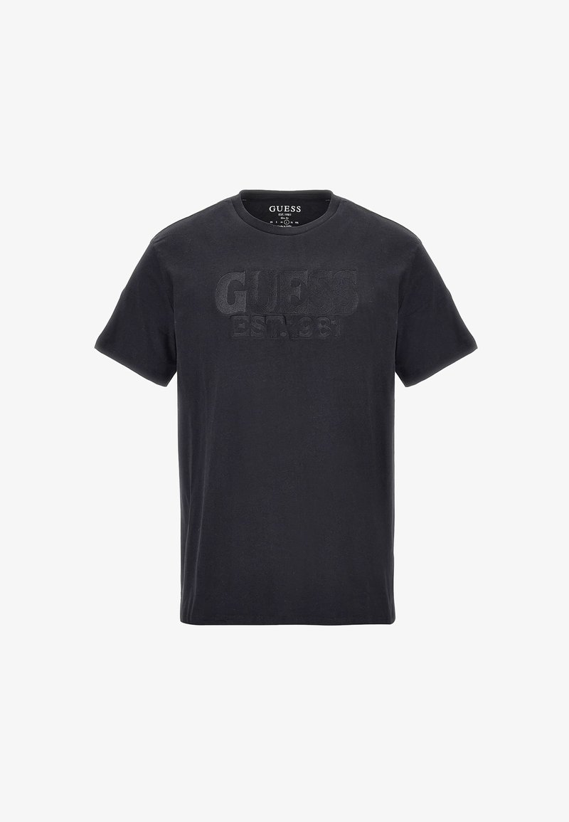 Sort T-shirt med korte ærmer og rund hals med prægede "GUESS EST. 1981" tekst på brystet.