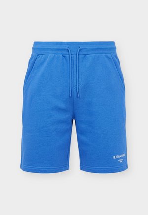 Niebieskie szorty ze sznurkiem, bocznymi kieszeniami i małym białym logo "Björn Borg Stockholm 1956" na dole prawej nogawki.