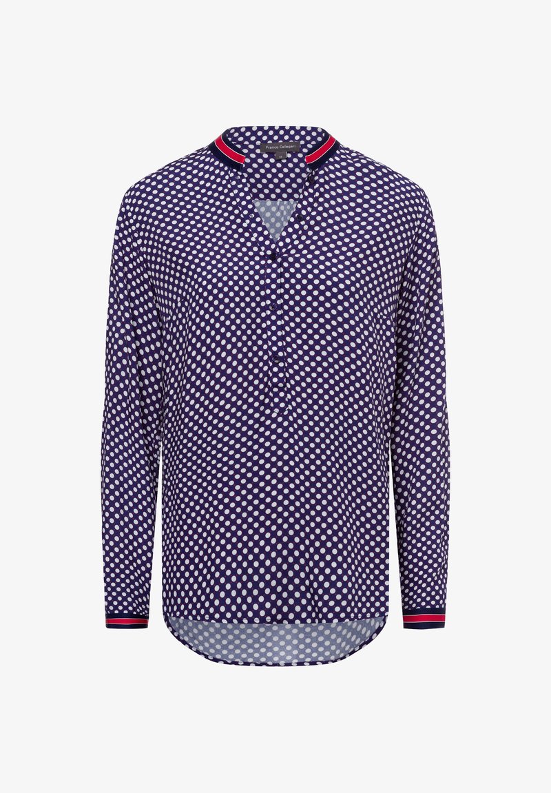 Langärmliges Hemd in Marineblau mit weißen Punkten. Verfügt über eine halbe Knopfleiste und akzentuiertem Kragen in rot-weißer Streifenoptik. Leichter Stoff.