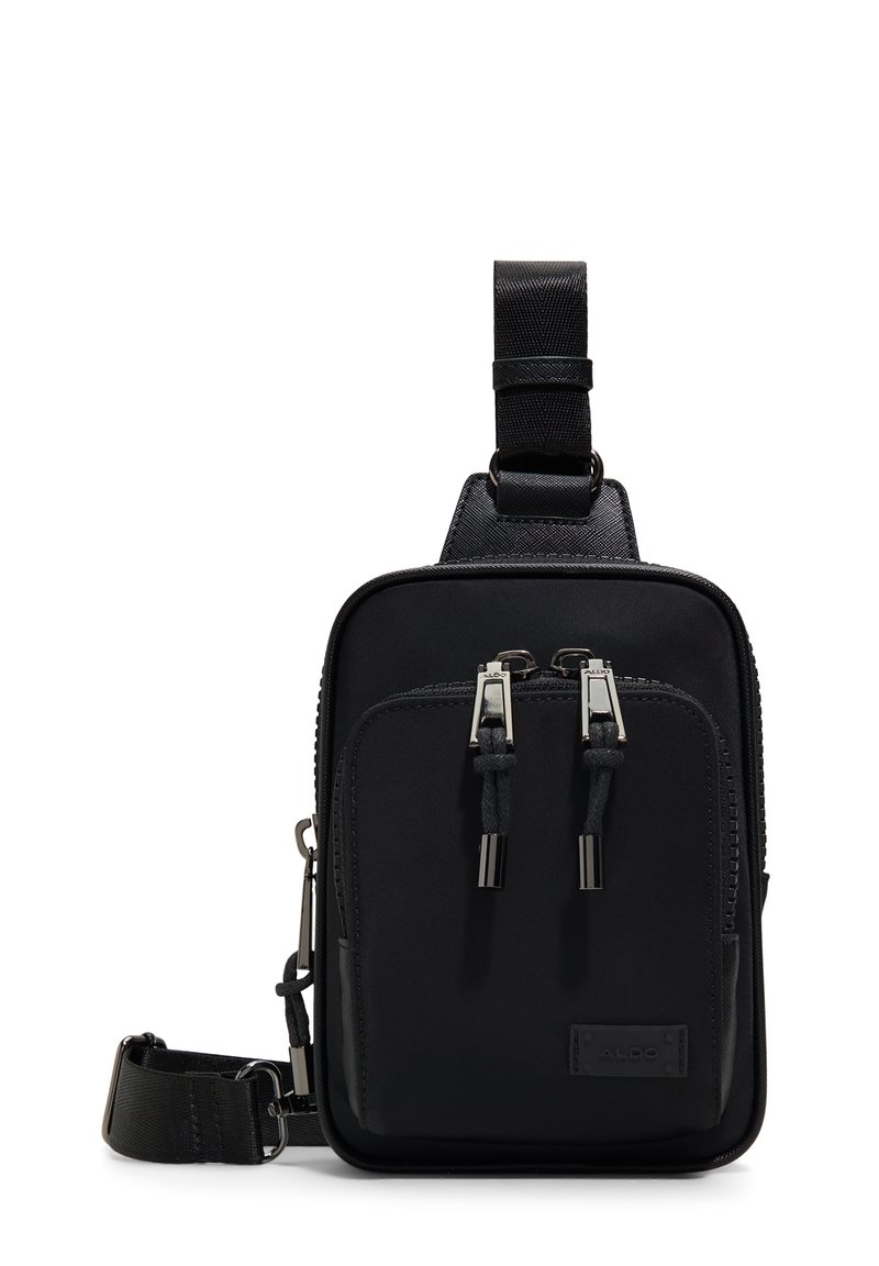 Black crossbody bag made of durable fabric with smooth texture. Features two zippered pockets, adjustable strap, and silver-tone hardware.