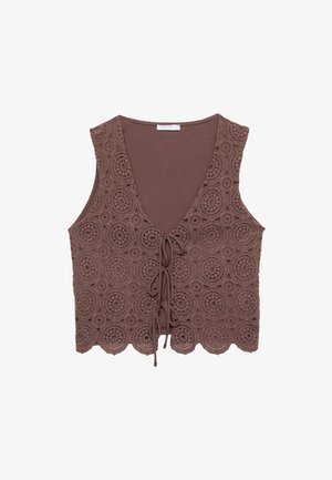 Brun virkad topp med V-hals, snörning fram och vågig nederkant, med cirkulära mönster genom det strukturerade tyget.