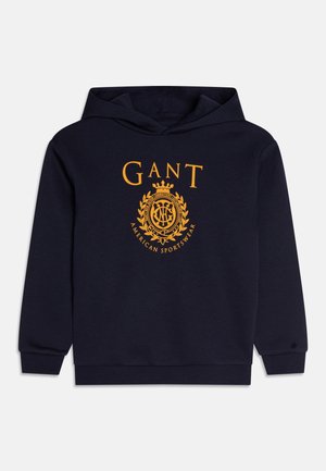 Mørkeblå hættetrøje med orange "GANT American Sportswear"-logo og våbenskjold centreret på fronten, med ribstrikkede manchetter og kant.