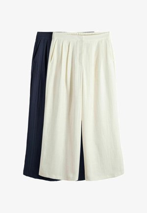 Locker sitzende Weitbein-Hose in Creme und Marineblau, mit Falten und Seitentaschen, überlappend auf weißem Hintergrund dargestellt.