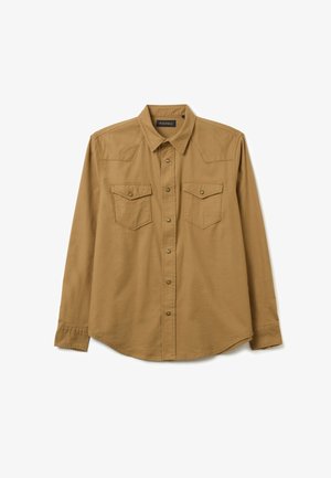 Camisa de manga larga en algodón marrón claro. Presenta dos bolsillos en el pecho con cierre a presión, yokes en los hombros y un cuello abotonado.