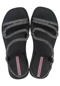 Sandali neri con cinghie argentate glitterate, caratterizzati da una soletta testurizzata e un design a punta quadrata. Etichetta con logo rosa sul lato.