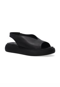 Černé kožené sandály s otevřenou špičkou a zavazováním na patě, s polstrovanou černou podrážkou a elegantním, minimalistickým designem. Obsahují mírně zvýšený podpatek.