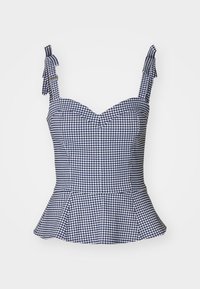 Top peplum a cuadros vichy en azul marino y blanco con un cuerpo ajustado, escote corazón y tirantes ajustables. Presenta un diseño estructurado.