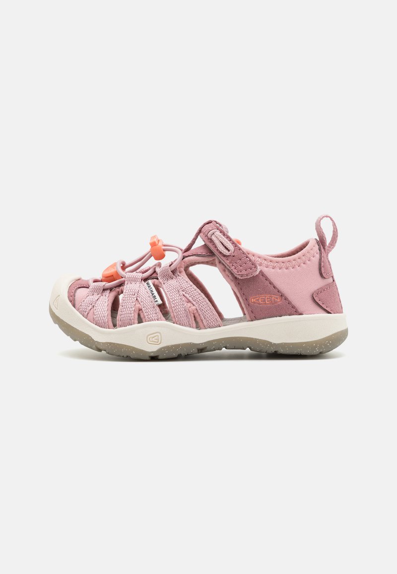 Pink open-toe sandals with elastic straps, pull tab, and orange accents. Textured upper, cushioned sole with speckles for grip.