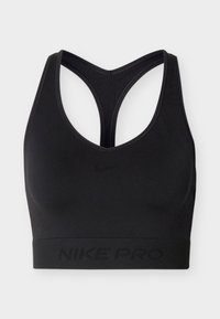 Brassière de sport Nike Pro noire avec design dos nageur et bande élastique en bas, arborant un discret logo et marquage Nike.