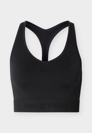 Μαύρο αθλητικό σουτιέν Nike Pro με σχεδιασμό racerback και ελαστική ταινία στο κάτω μέρος, διακοσμημένο διακριτικά με το λογότυπο και τη σήμανση της Nike.