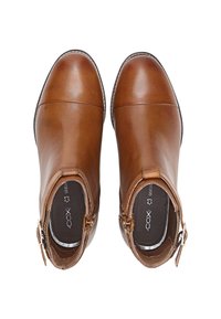 Brązowe skórzane botki za kostkę z zaokrąglonym noskiem, bocznymi zamkami błyskawicznymi i gładkim wykończeniem. Posiadają logo na wkładce.