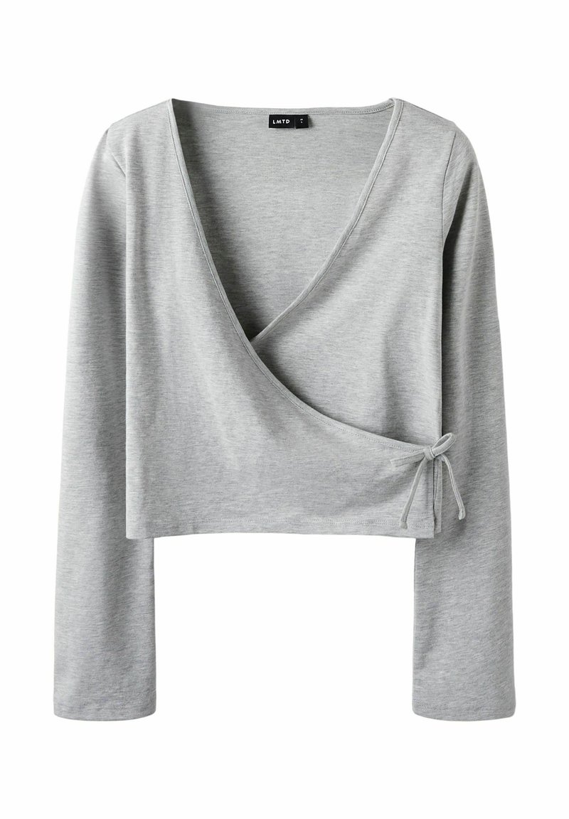 Gray long-sleeve wrap top in soft, stretchy fabric. Features a v-neckline and tying detail on the side. Cropped design.