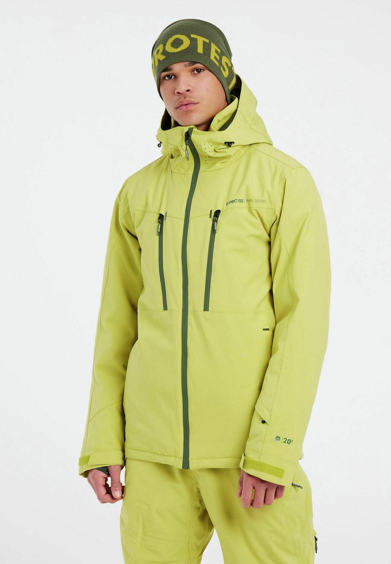 Limegrüne wasserfeste Skijacke mit Kapuze, mit Reißverschlusstaschen und atmungsaktivem Material, mit schwarzen Akzenten und Logo auf der Brust.