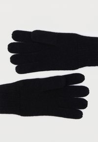 Μαύρα πλεκτά γάντια με πέντε δάχτυλα, ριμπ μανσέτες, απαλή υφή και χωρίς εμφανή σχέδια ή εξαρτήματα.