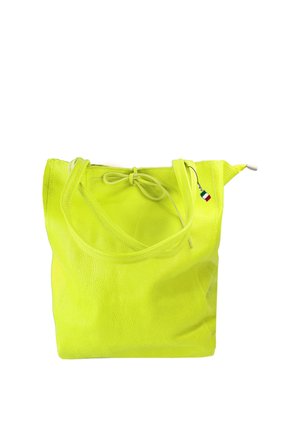 Bright yellow leather tote bag with dual handles, a tied bow detail, and a small Italian flag charm attached to one handle.