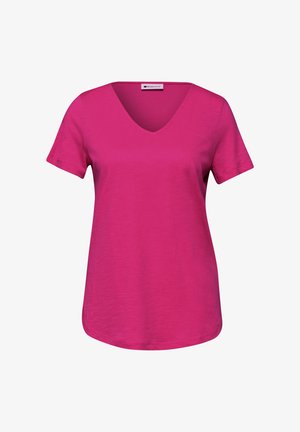 T-shirt rose vif à manches courtes avec col en V et ourlet légèrement arrondi, présenté de face sur un fond blanc uni.