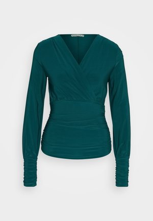 Teal lange mouw top met een wikkelontwerp, geraffineerde zijkanten en gerimpelde lange mouwen. Gemaakt van een zachte, rekbare stof.