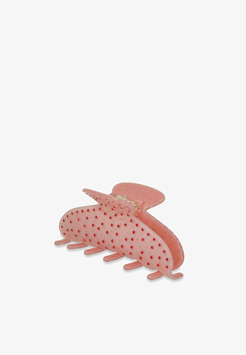Clip de pelo en color rosa con un acabado semitransparente, que presenta acentos texturizados y pequeñas cuentas rojas y doradas en toda su superficie.