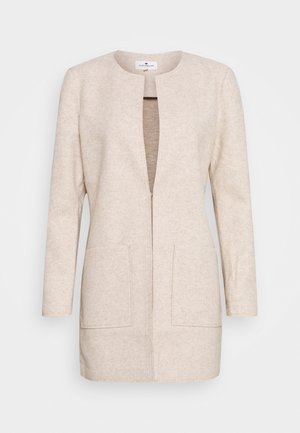 Beigenvärinen pitkähihaisen takki, jossa avonainen edessä, kaksi etutaskua, pyöreä pääntie ja suora helma.