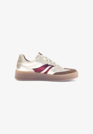 Metallic silver sneaker with burgundy accents, suede details, round toe, flat rubber sole, and white laces. Stitched design along the edges.