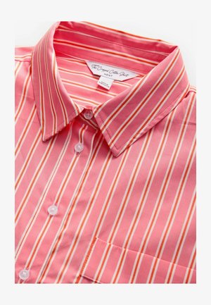 Rožinė ir balta dryžuota trumpa medvilninė marškinė su apykakle, turinti mygtukų užsegimą ir vieną krūtinės kišenę. Minkšta tekstūra ir lengvas audinys.