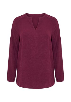Pitkähihainen, tummanpunainen pusero, jossa on jaettu pyöreä pääntie ja rento istuvuus, valmistettu teksturoidusta kankaasta.
