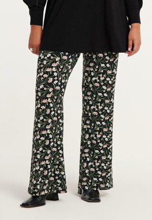 Uiteinde broeken in zwarte stof met een bloemenpatroon met witte en rode bloemen. Het ontwerp heeft een soepele textuur en een verlengd pasvorm.