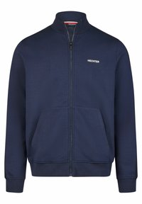Marineblaue Zip-Jacke aus weichem Stoff, mit hohem Kragen, zwei vorderen Taschen und einem weißen Logo auf der linken Brust.