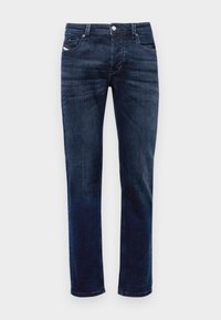 Tmavě modré džíny z denimu s rovnými nohavicemi, které mají zipový klip, design se pěti kapsami a jemné detaily prošívání. Hladká textura.