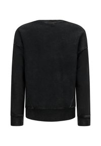Felpa nera con scollatura tonda, maniche lunghe e polsini a coste. Presenta una texture sbiadita e una vestibilità rilassata, con un sottile dettaglio del logo.