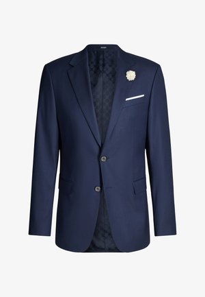 Marineblauw herensuitjasje met twee knopen, ingesneden revers, een witte pochet en een witte bloemspeld op het linkerrevers.