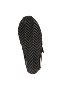 Black rubber shoe sole with a zigzag tread pattern. Smooth edges and a textured surface for grip. No visible logos or distinctive accents.