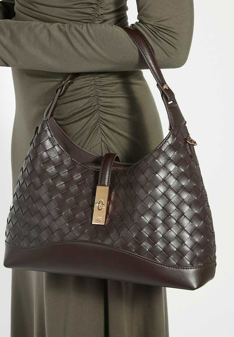 Brown woven leather handbag with a smooth base, gold hardware, and a zip closure. The structured shape features a single shoulder strap.