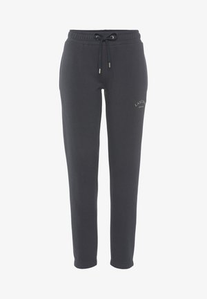 Pantaloni della tuta grigi scuri realizzati in misto cotone, con vita regolabile tramite coulisse, design a gamba affusolata e piccolo logo dettagliato sul fronte.