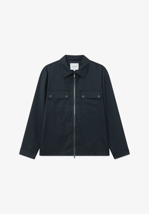 Veste bleu marine avec fermeture éclair à l'avant, manches longues et deux poches poitrine. Dispose d'un col pointu et d'un design épuré et minimaliste.