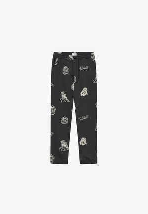 Pantaloni della tuta neri con un motivo a tutto campo di loghi Yale e illustrazioni di bulldog in beige. Vita elastica con cordoncino.
