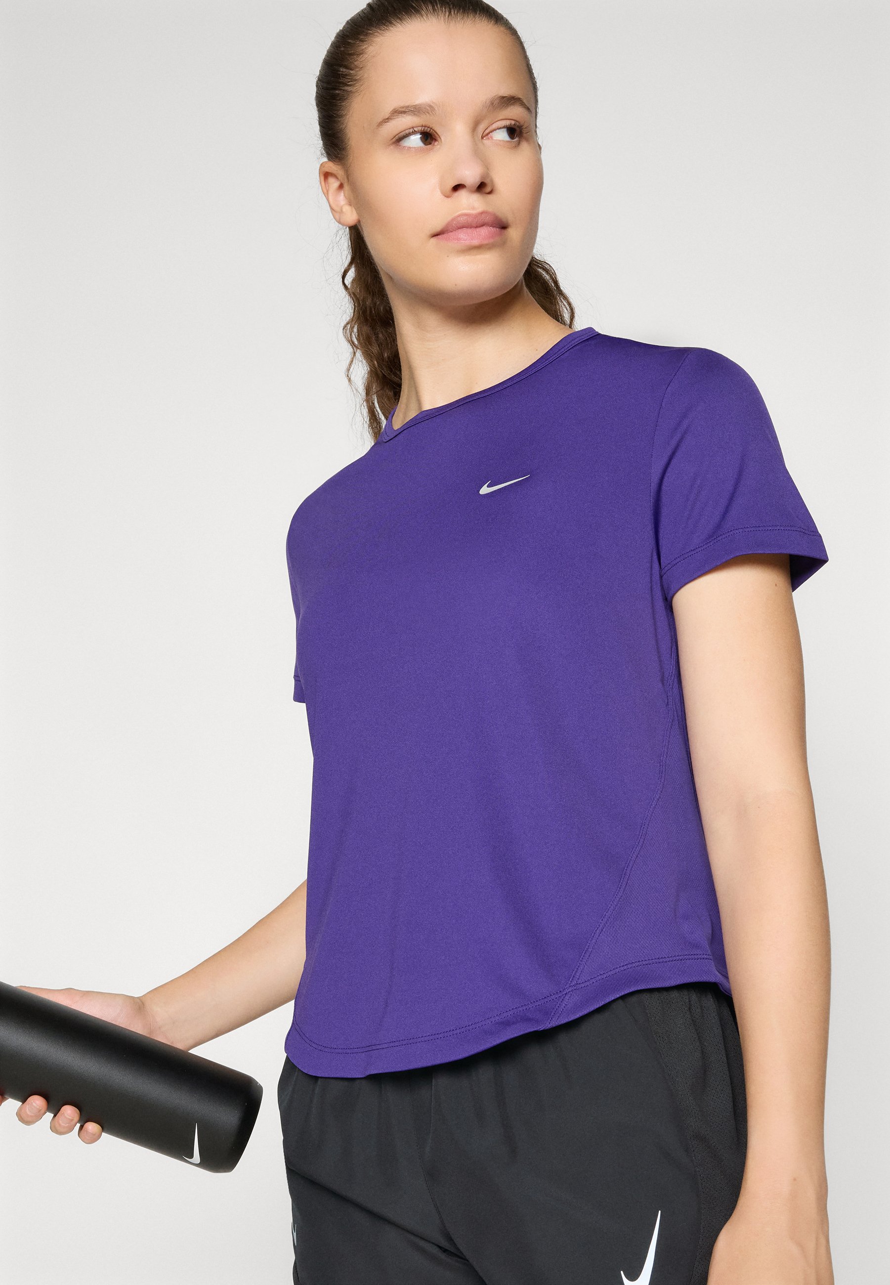 purple black and white nike shirt