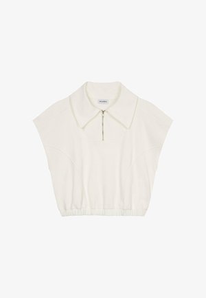 Īsām piedurknēm, saīsināts tops no neitrālas krāsas auduma. Ir liels apkaklis un priekšējais rāvējslēdzis. Rūpīgi izšūtas šuves gar malām.