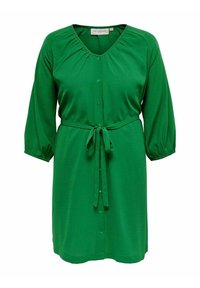 Groene jurk tot de knie met driekwart mouwen, knoopsluiting aan de voorkant, plooikraag en een strikceintuur.