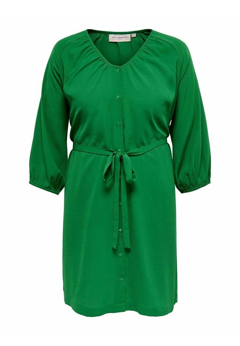 Groene jurk tot de knie met driekwart mouwen, knoopsluiting aan de voorkant, plooikraag en een strikceintuur.