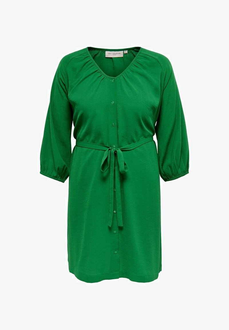 Groene jurk tot de knie met driekwart mouwen, knoopsluiting aan de voorkant, plooikraag en een strikceintuur.