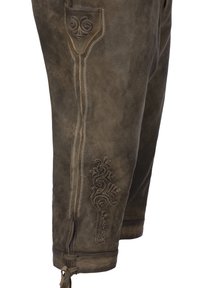Hnědé kožené kalhoty s propracovanými vyšívanými vzory na kapsách. Mají měkkou texturu, zúžený střih a nastavitelné šněrování na kotnících.