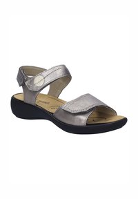 Stříbrné kožené sandály s nastavitelnými popruhy, otevřenou špičkou a černou gumovou podrážkou. Mají polstrovanou stélku pro pohodlí.