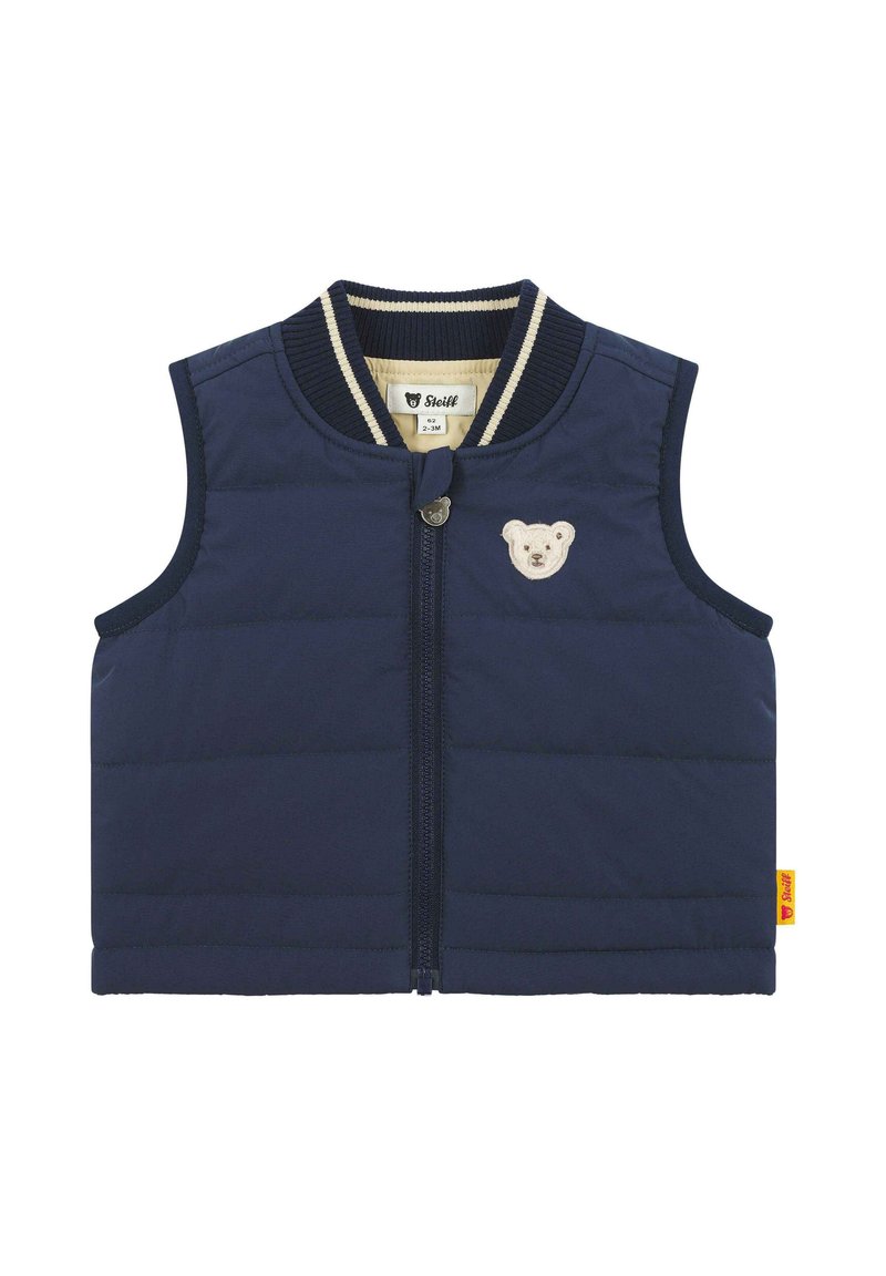 Gilet senza maniche blu navy con motivo a righe trapuntato orizzontali, zip frontale e applicazione a forma di orsetto sulla parte sinistra del petto. Collo a costine.