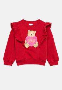 Czerwona bluza z marszczonymi rękawami, z nadrukiem misia trzymającego różowe serce z napisem „GAP”. Miękka tkanina, luźny krój.